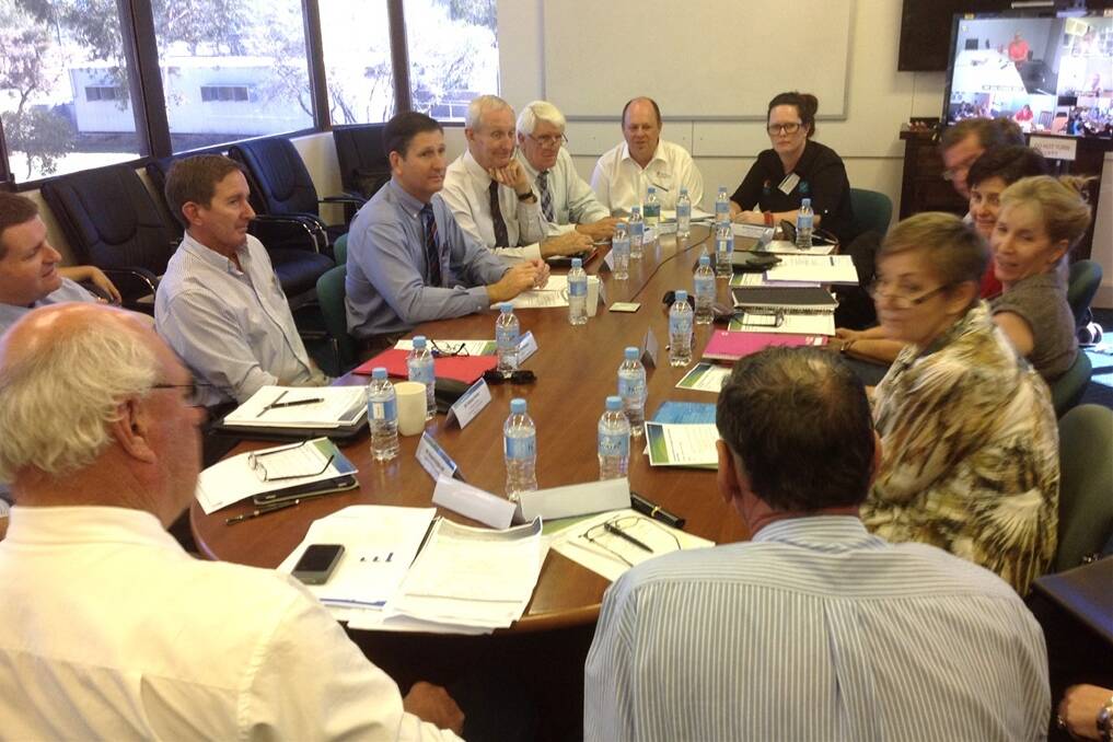 Health Minister Lawrence Springborg (centre left) chairing the round table for mental health in Charleville this morning. Representatives from Theodore, Mt Isa, Roma, and Longreach also participated in the round table via a video link.