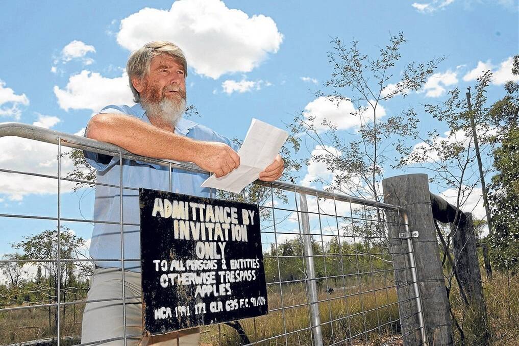 FLASHBACK: Kogan landholder Brian Monk, Iona, as he appeared on the front page of Queensland Country Life last November, brandishing a letter from NuGrow informing him of plans to develop a CSG waste dump next to his property.