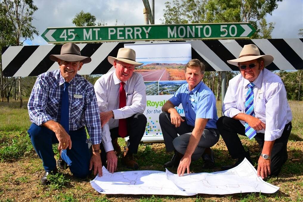 North Burnett Regional Council Mayor Don Waugh and councillors Paul Francis and Paul Lobergeier survey plans for the Monto-Mt Perry road with Deputy Premier Jeff Seeney.