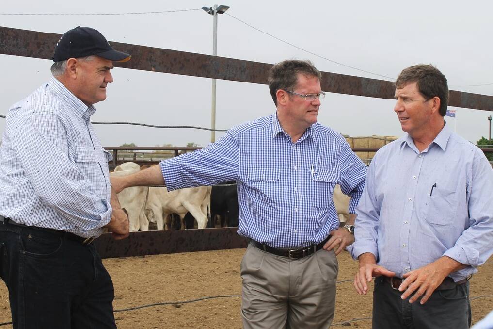 State Agriculture Minister John McVeigh, pictured at Longreach in February with AgForce president Ian Burnett and NFF president Brent Finlay during the Prime Minister's drought tour, is calling an urgent meeting to discuss wild dog drought funding.