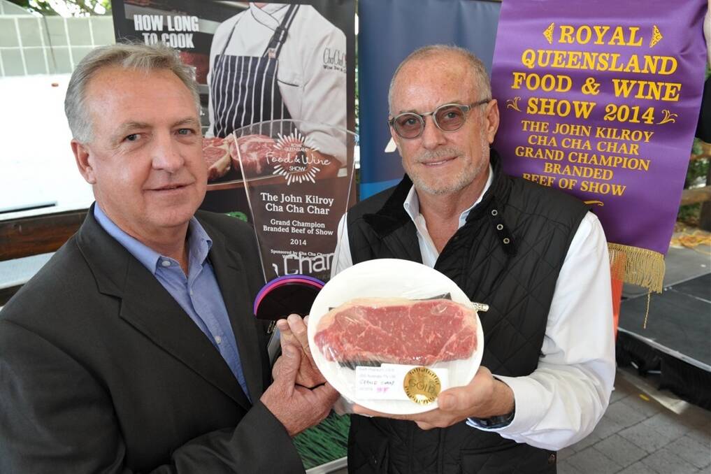 Denis Conroy, JBS, Ipswich, is presented the award for champion branded beef by John Kilroy, Cha Cha Char, Brisbane. 