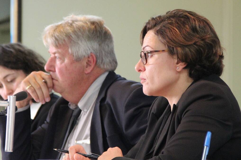 Member for Lockyer Ian Rickus and Member for South Brisbane Jackie Trad hear statements from producers at Tuesday’s meeting.