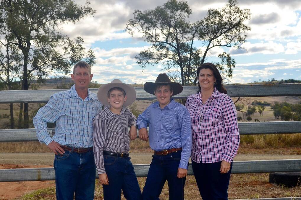Craig and Anna Radel with their children, Angus and Jackson, at their Biloela property, Attunga, which they hope will be certified organic by next year. 