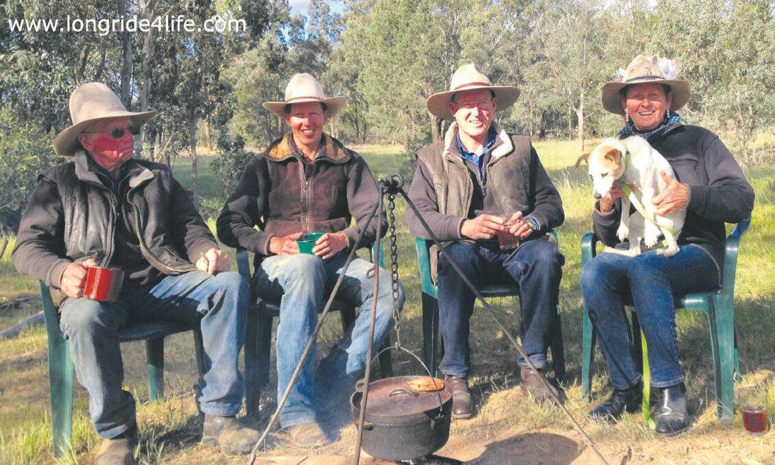 The Long Ride 4 Life crew – Harold Riley, Anna Hoogeboom, Andrew Gibson and Terrill Riley-Gibson – relaxing on a rare day off at Lockhart, NSW, only a few weeks away from their target of 3000km on horseback to raise money for the Royal Flying Doctor Service and the Leukaemia Foundation.