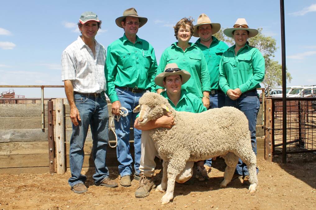 Purchaser of the top priced ram at Colanya, Ashley Fegan, Kelloshiel, Julia Creek with stud vendors, Pat and Sue Hegarty, Mitch Black, Emma Hegarty and front, James Hegarty holding the ram.