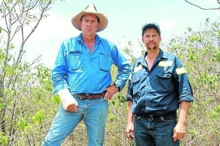 Stephen Busby and Mick Goggi point out the lantana on one of the lease areas held by Darcy Ward.