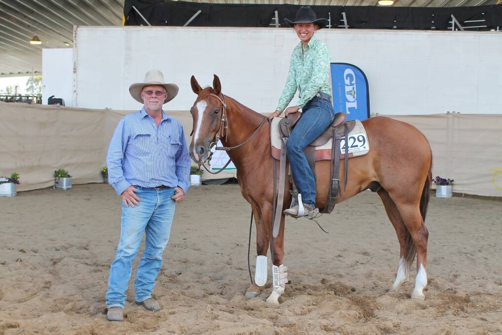 Mundubbera trainer Leah Read and her $20,000 top-priced gelding, Marnies Token Acres with buyer Tony Dawson of Warra.
