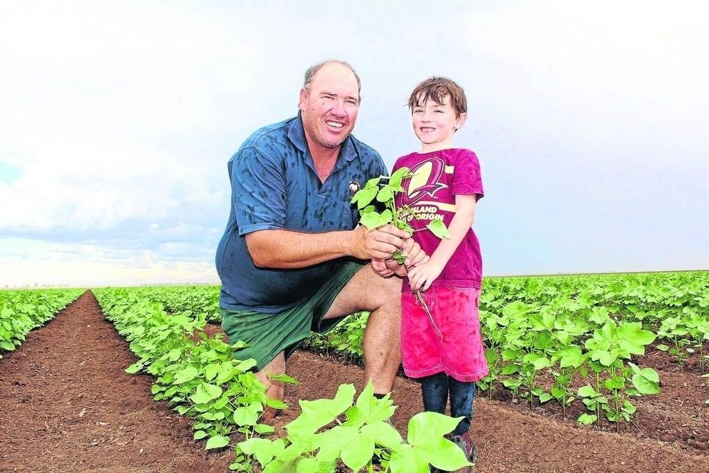 Scott Armstrong and six-year-old son Jeremy continue to receive a higher gross margin by growing 50pc conventional cotton at Sharmarel, St George. - <i>Picture: ANDREA CROTHERS.</i>