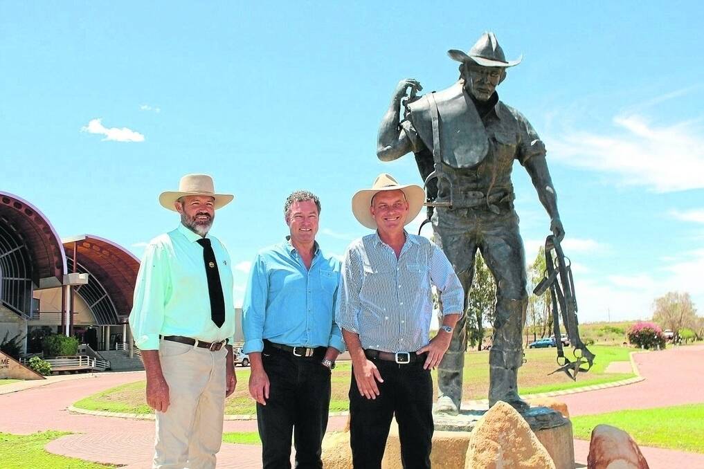 ICPA president Andrew Pegler welcomes Education Minister John-Paul Langbroek's remote tuition allowance increase, alongside Lachlan Millar, LNP candidate for Gregory, at Longreach on Monday.