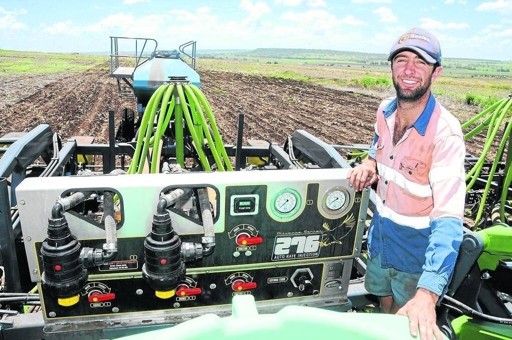 Farm manager Matt Young with the dual liquid fertiliser system fitted to the new Boss disc opener planter that has been used to sow summer crops on Canning Downs South's farms in the Killarney and Allora area. - <i>Picture: SARAH COULTON.</i>
