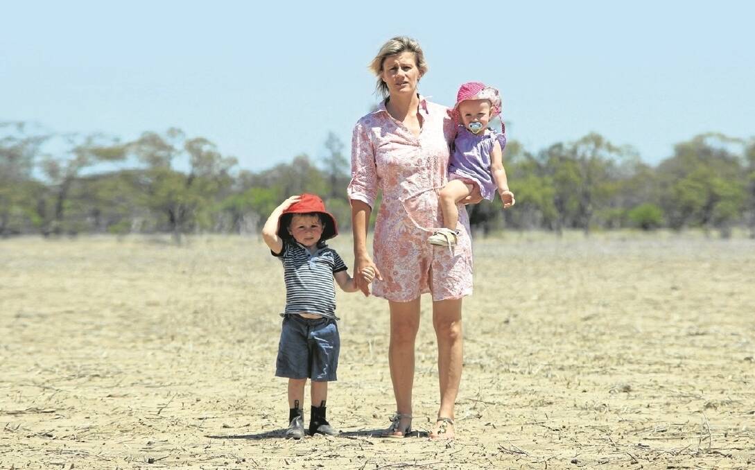 Theresa Pilcher, Leithmoor, Thallon, with her son Jack and daughter Tilly, is facing a bleak winter cropping season with no rain in sight and no help from the federal government.