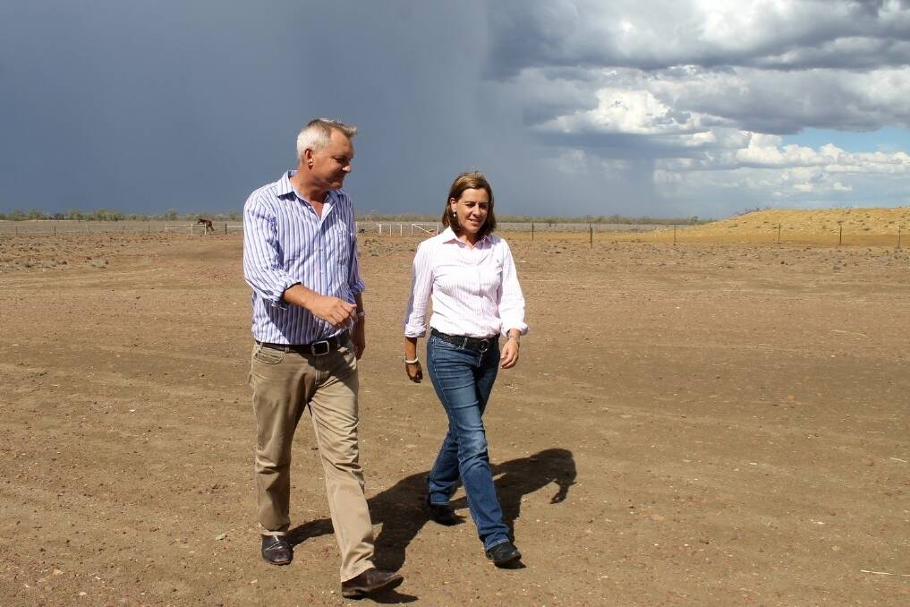 Against a background of a short heat storm, Member for Gregory Lachlan Millar shows shadow Agriculture Minister Deb Frecklington the extent of the drought in the Longreach region.