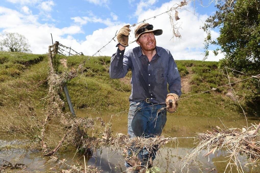 Andrew Burnett, Sexton Dairy, Gympie, inspects flood damage on his property. <i>- Picture: ROD GREEN.</i>