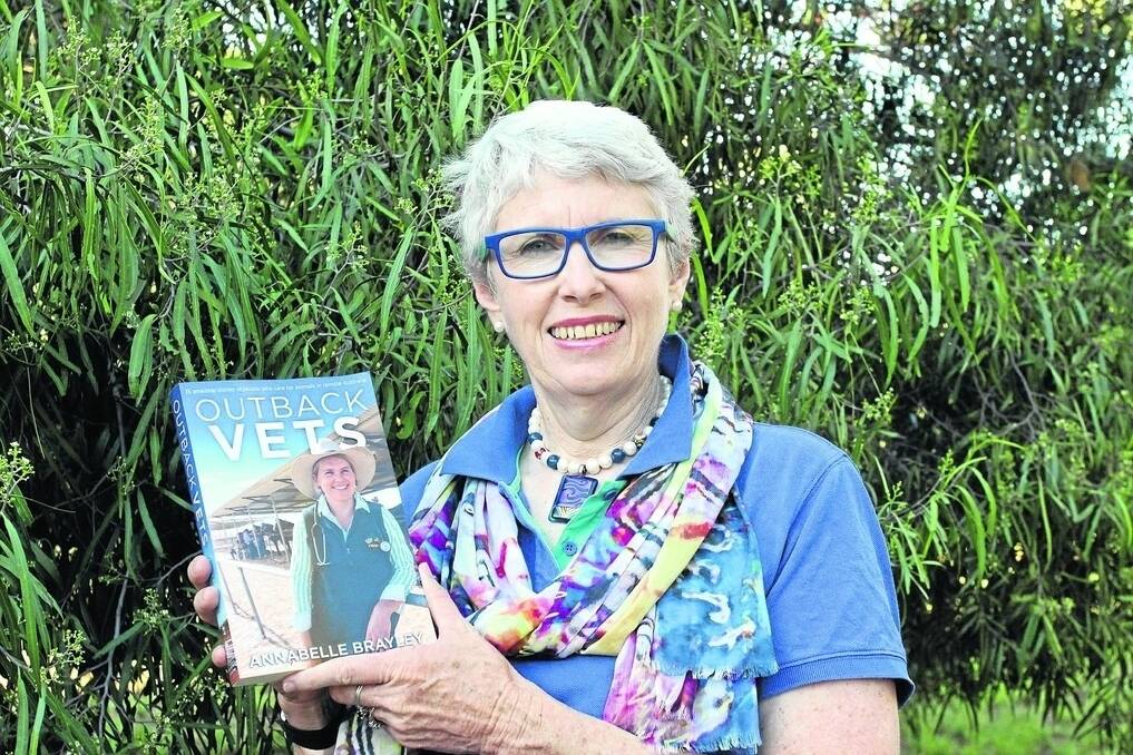 Storyteller Annabelle Brayley of Morven, with a copy of her latest book Outback Vets, which will hit the bookstores this week.