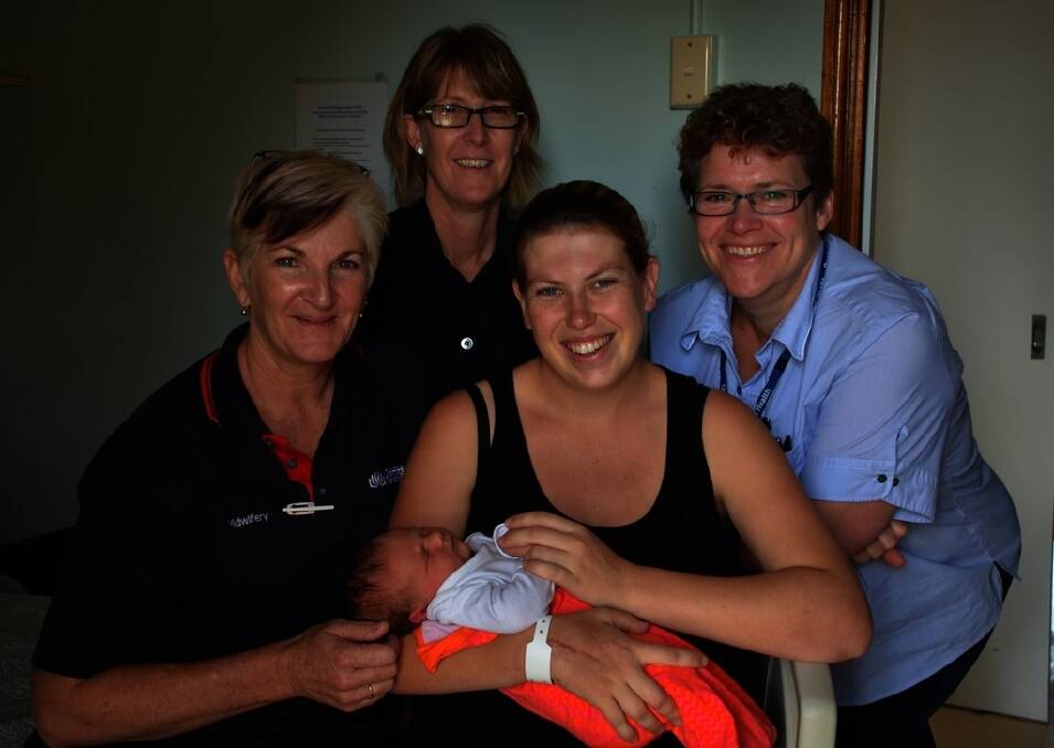 Midwifery student Carolyn Fardon, midwife Fiona McDermott with Petra Thomas and her new baby and Roma midwifery unit manager Anne Bousfield.