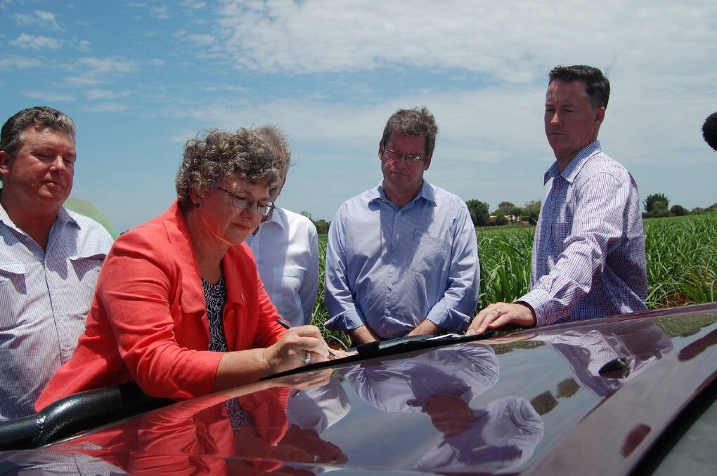 High profile contributors to the Agricultural Energy Council at the launch in Bundaberg last year before the Council was closed earlier this year by current Queensland Government.  CAPTION: (Energy Council Axed B.jpg) AgForce vice president Georgie Somerset signing the Memorandum of Understanding at the launch of the now defunct Agricultural Energy Council in Bundaberg last December. 