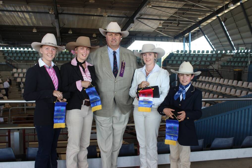 Judge Rob Sinnamon, Yulgilbar Santa Gertrudis Stud, Baryulgil, NSW, with the winners of the young judges Lauren Moody, Dubbo, NSW, who won the 12 to 15 years, Chloe Gould, Bowenfels Angus, Nanago, who won the 18 to 25 years, Sarah Peters, Sunshine Coast, who won the 15 to 18 years, and named overall champion, and Georgie Coombs, Moura, who won the under 12 years. 