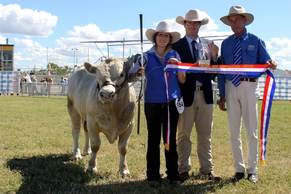 Jubilant 18-year-old Lockyer Valley breeder Cheneya Freese holds her grand champion Square Meater bull, Serenity Plains Judge, along with judge Steve Pocock, and Gary Sewell, chairman of the Square Meaters Cattle Association Australia.