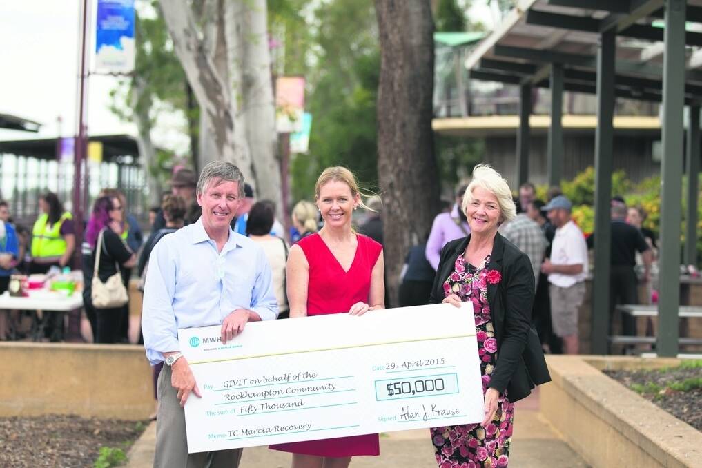 MWH CEO Alan Krause presents the cheque for $50,000 to GIVIT's Sarah Tennant and Rockhampton Regional Council mayor Margaret Strehlow.