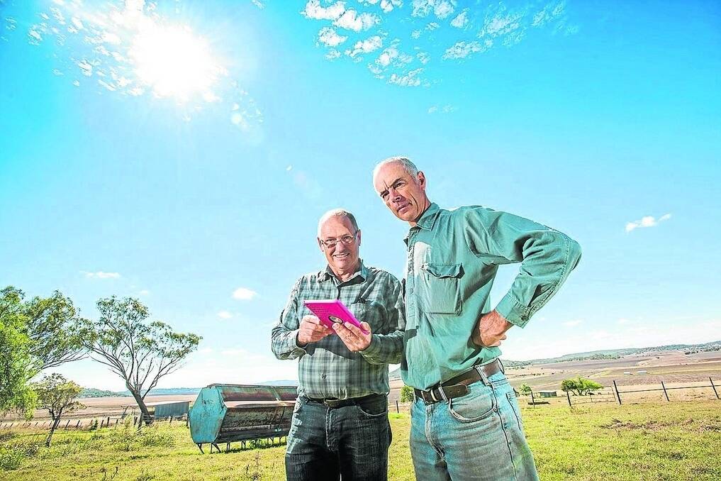 Dr Brett Robinson from the University of Southern Queensland's National Centre for Engineering in Agriculture runs through SWApp with Darling Downs farmer Rob McCreath at Prestbury, Felton.