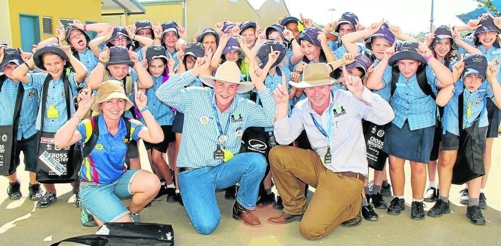 COOL CALVES: Children from St MaryÆs Catholic Primary School in Rockhampton get a guided tour during Beef Week thanks to teacher Louise McNamara and Young Farming Champions Tim Eyes and Dwayne Schubert. - Picture: ANDREA CROTHERS.