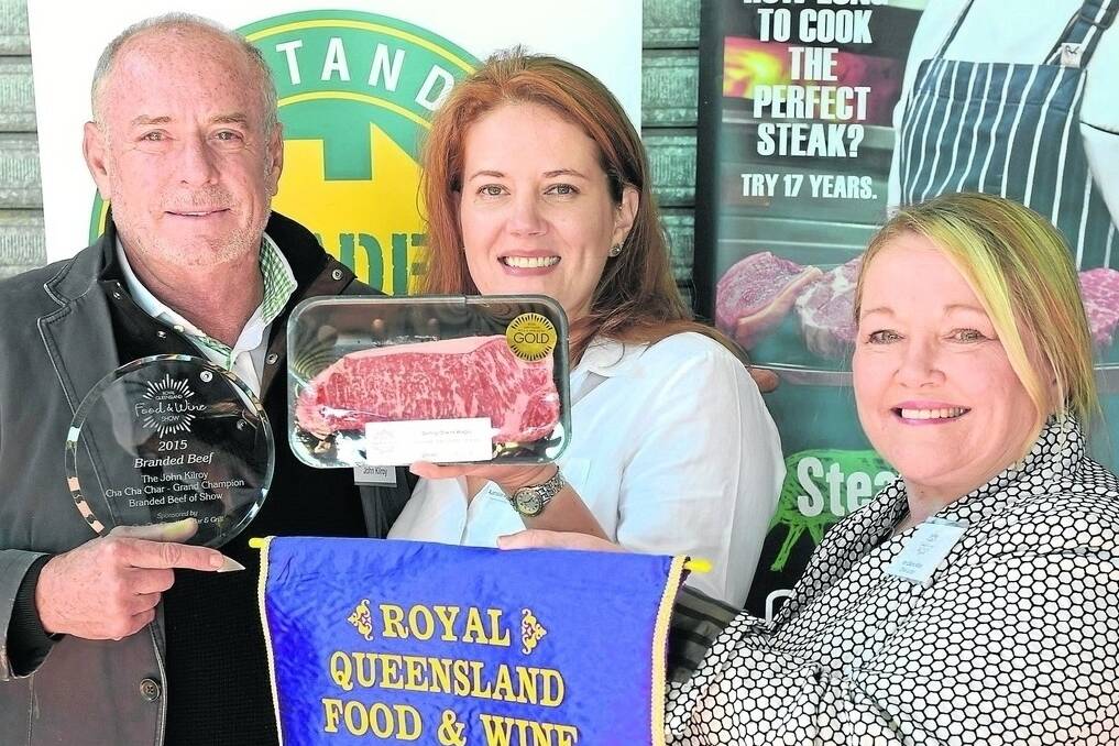 Judges John Kilroy and Elaine Millar congratulate Sabina Kindler, representing AACo, for winning the RQFWS John Kilroy Cha Cha Char Grand Champion Branded Beef of Show with a Darling Downs Wagyu F1 entry. - <i>Picture: RODNEY GREEN.</i>