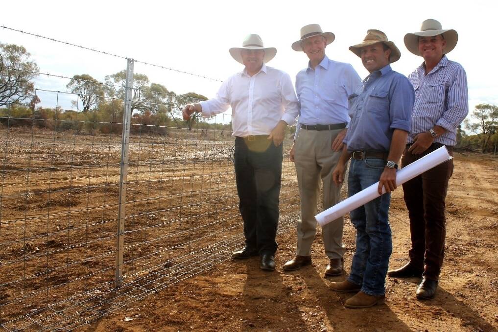 Treasurer Joe Hockey inspected a fencing project at Longreach to emphasise budget write-offs for primary producers. He's pictured with Member for Maranoa Bruce Scott, property owner Dom Burdon and state MP Lachlan Millar.