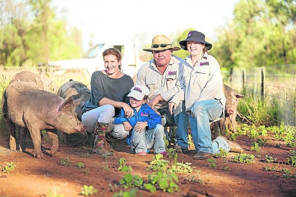 Mark and Charisse Ladner, Gooralie free-range pork, with two of their children, Bonnie and Tiggy, at the family property. - <i>Picture: MELISSA GLADMAN.</i>