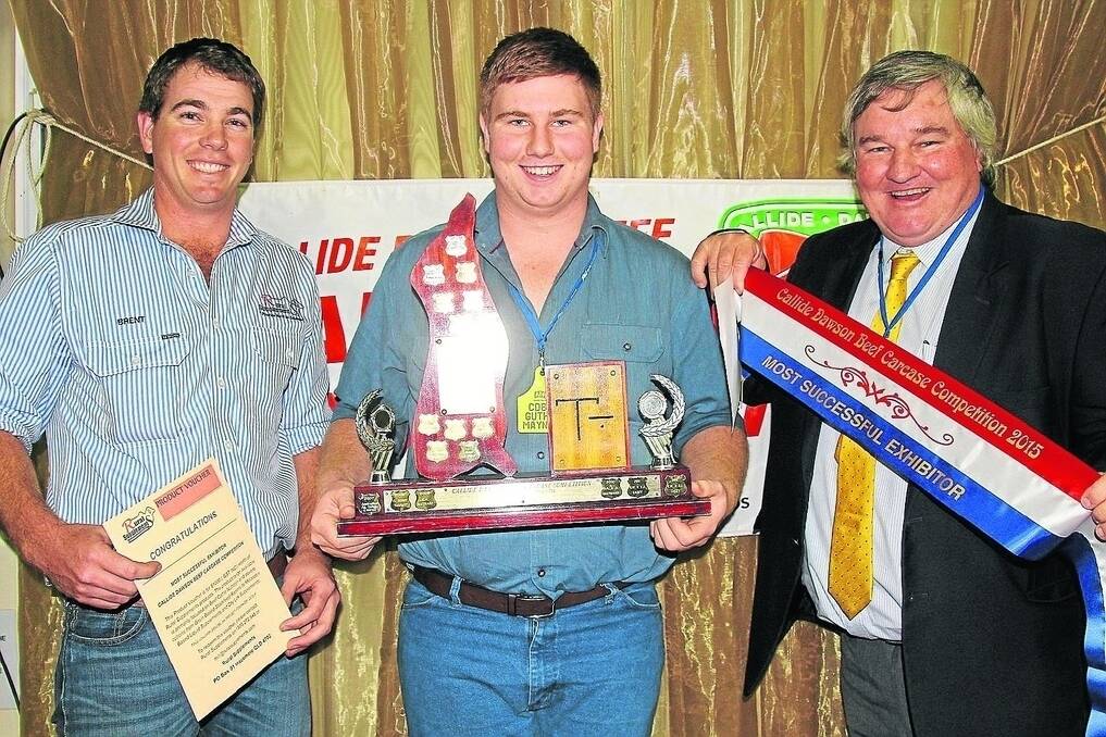 Brent Williams, Rural Supplements, Bouldercombe, presents Guthrie and Geoff Maynard, Mount Eugene, Jambin with their most successful exhibitor award at the Callide Dawson Carcase competition at as dinner in Biloela last Friday evening.