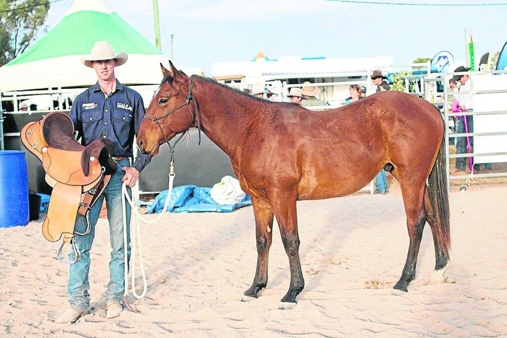 Winner of the 2015 Ag-Grow colt starting competition Luke Bennett, Dundee, NSW, with TN Tessa Rey and the trophy saddle, the Millennium Drafter.
