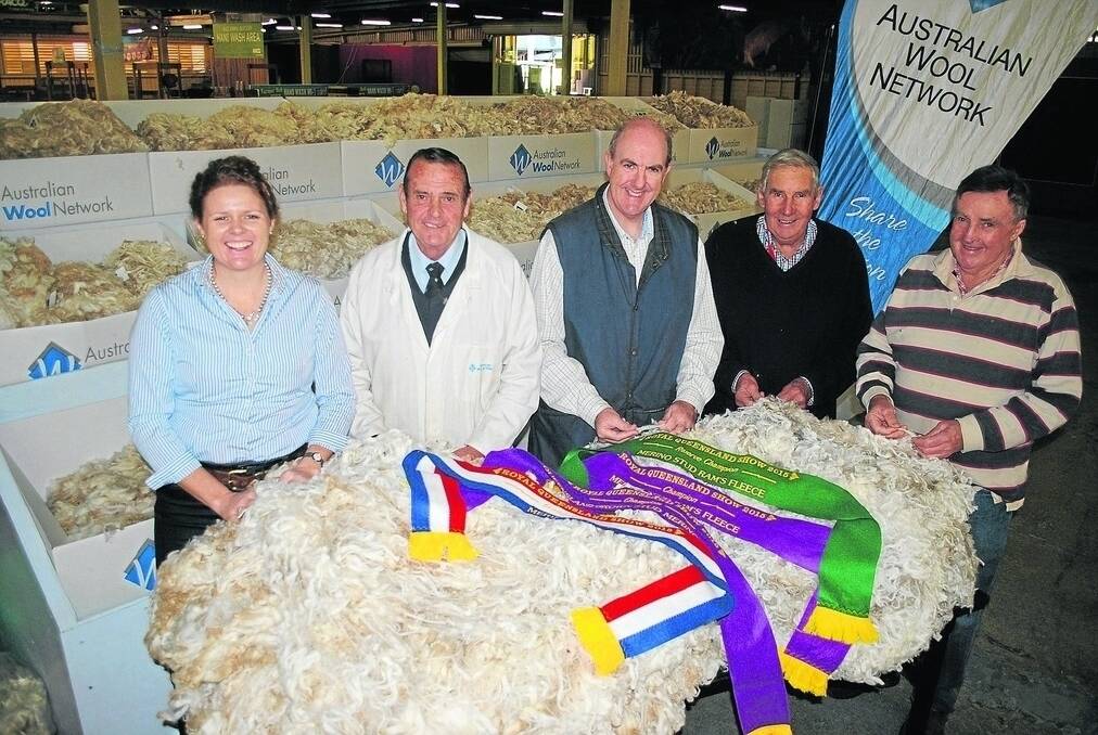 Libby Thompson, Lyntarra, Texas, judge Warren Zernike, AWN, RNA wool steward Craig Turner, Sandy Kemp, Mulgowie, and Toddy Kemp, Yeronga, with Jolly Jumbuck's champion and Victoria Downs' reserve champion fleeces of the 2015 Royal Queensland Show.