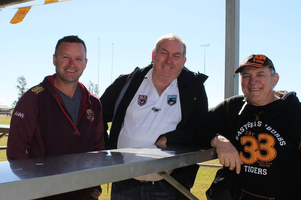 QRL major competitions manager David Maiden and central Queensland division chairman Danny Maguire with East Tigers coach and footballing legend Des Morris soaking up some winter sun at Blackall on Sunday morning.