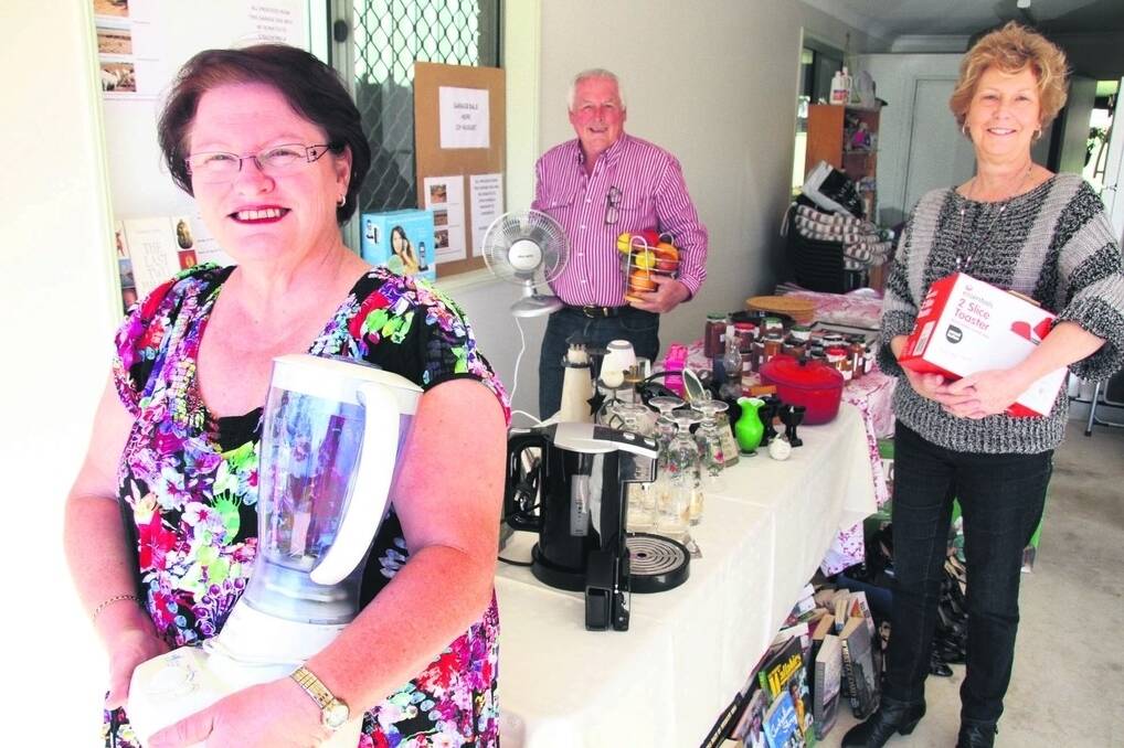 Debbie Hunter, Garry Symonds and Karyn Owen have organised a garage sale in Thornlands to help a grazing family in Longreach. - <i>Picture: Chris McCormack.</i>