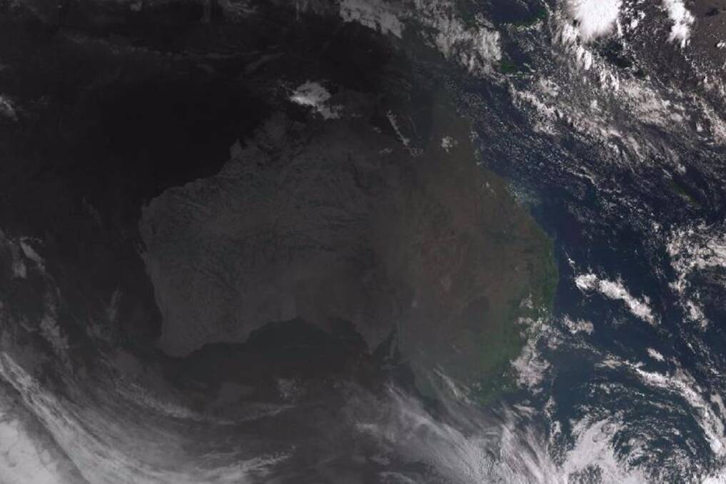 A satellite image showing the sun rising over Australia. 
