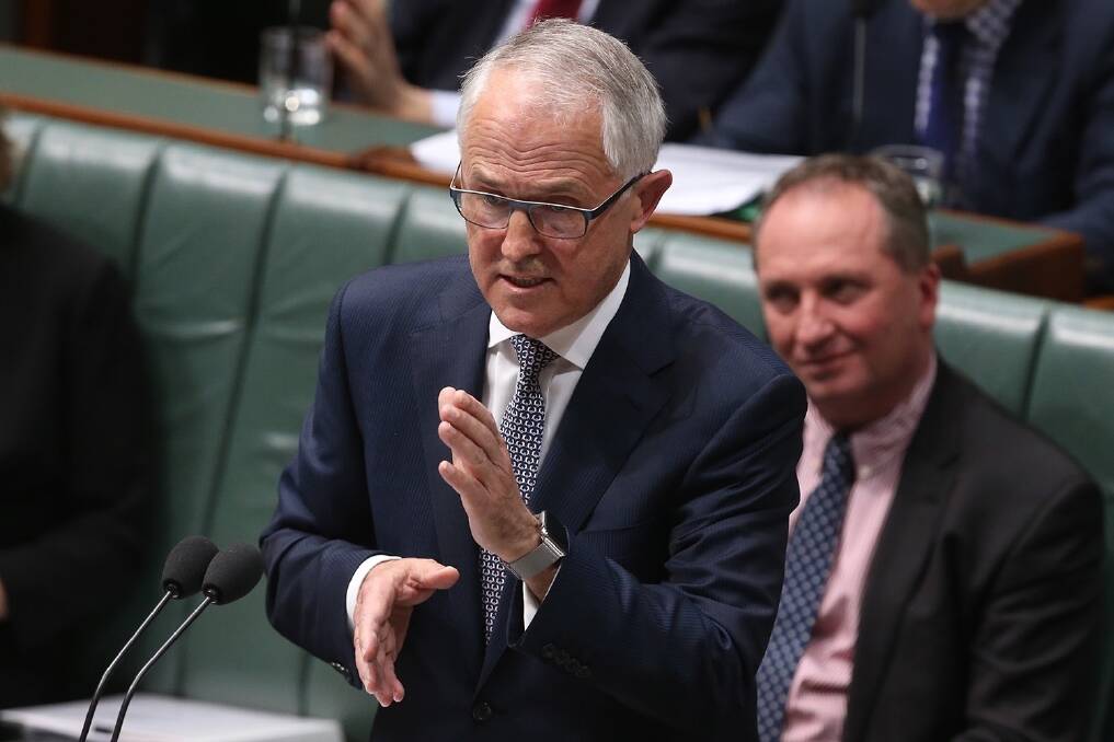 Prime Minister Malcolm Turnbull during question time with Agriculture and Water Resources Minister Barnaby Joyce in the background. Photo: Andrew Meares