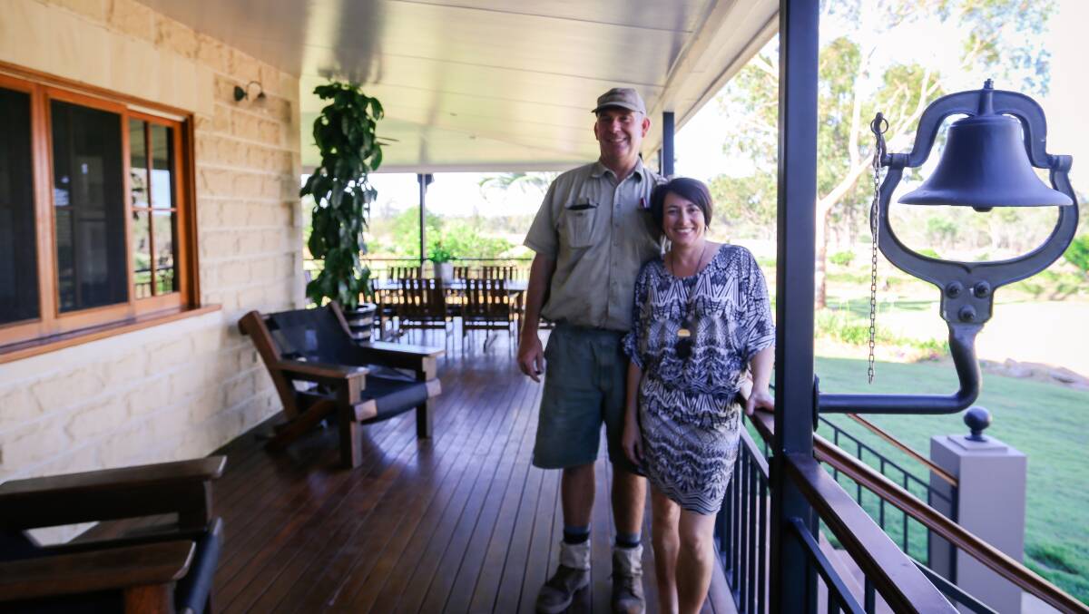 WINDY HILL: Neek and Robyn Morawitz, Windy Hill and Argoon, Comet, stand on the deck which wraps around the beautiful homestead - complete with the dinner bell. 
