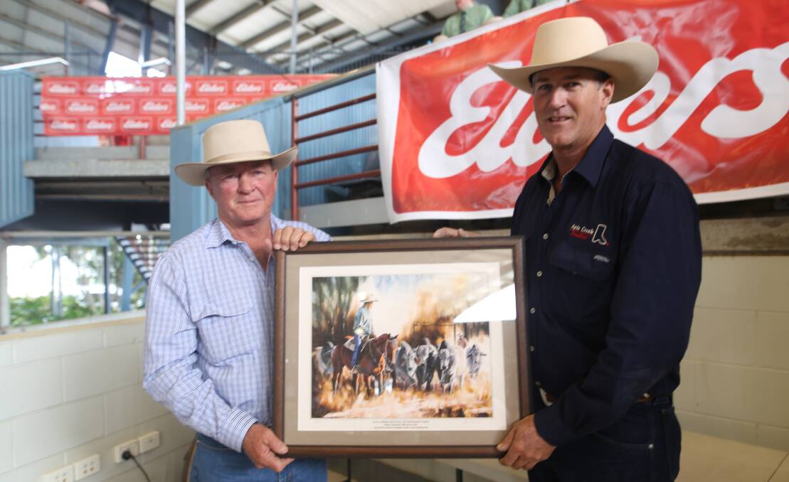 Stewart Nobbs, Yoman,  Moura presents Tim Olive, Apis Creet, Marlborough with the reserve champion grainfed pen of steers.  