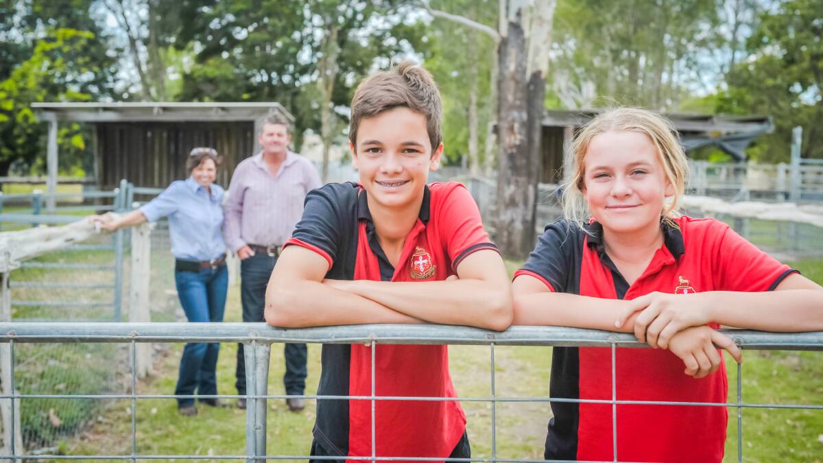 The Rockhampton Grammar School Year 8 students Rhett Austin, Kooroowatha, Theodore, and Dusty Lasker, Morney Plains Station, Windorah, stand before AgForce's Sharon Purcell and Grant Maudsley at RGS today. Photo - Kelly Butterworth. 