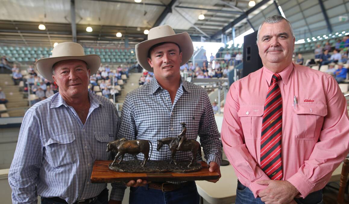 Stewart Nobbs and his son Tom, Yoman Cattle Co, Moura were congratulated by Greg Dunne, Northern state manager, Elders, for winning the grand champion pen at the Elders Commercial Cattle Show and Sale held as part of the 18th World Brahman Congress.  
