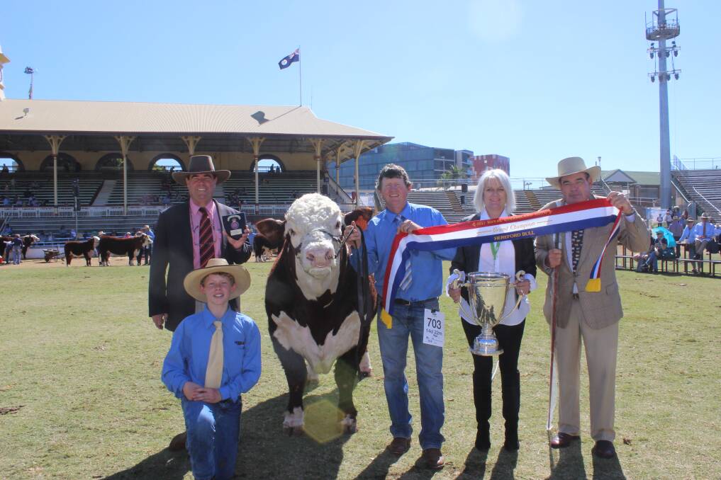 Grand champion bull Thornleigh Legume, with Brian Kennedy, Ben Monie, Hugo Monie,and decorated by Margie Adman, and Richard Wilson.