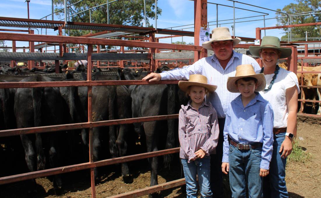 Michael and Jessica Smith from Adrigoole, Wodenbong, with their children Bobbie and Jack claimed the champion pen of heifers with their pen of 15 Angus heifers aged from eight months straight off their mothers.These heifers with an average weight of 346/kg and sold for 445c/kg to return $1541/head. Picture Helen Walker