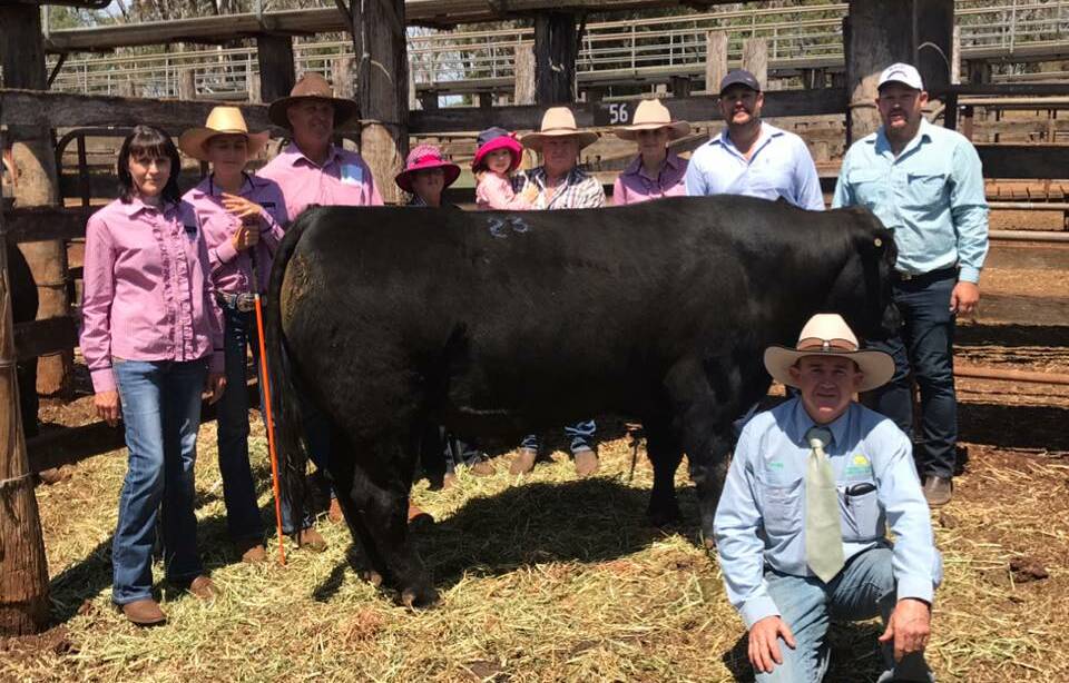 Ruby Ridge Looney sold for $6500 and is with vendors the Powman family and buyers the Bourke family with auctioneer James Bredhauer, Aussie Land and Livestock Kingaroy in front.