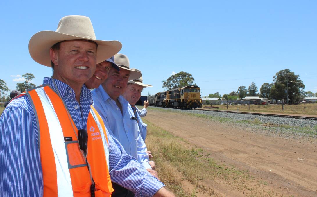 Arrived: Oakey Beef livestock manager Kurt Wockner, Quilpie mayor Stuart Mackenzie, SW RED chairman Lindsay Godfrey and Vaughan Johnson greet the cattle train on its arrival into Oakey on Wednesday. Picture: Helen Walker