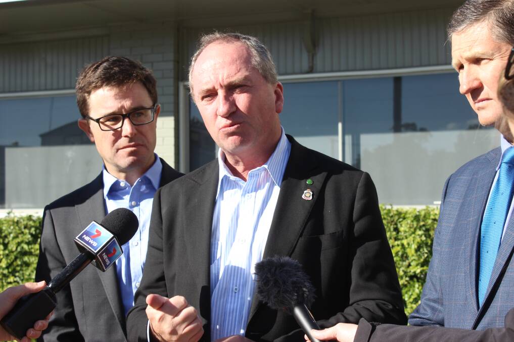 Minister for Agriculture and Deputy Prime Minister Barnaby Joyce, accompanied by the member for Maranoa,  David Littleproud, and member for Southern Downs, Lawrence Springborg addresses the media in Goondiwindi on Thursday morning. 