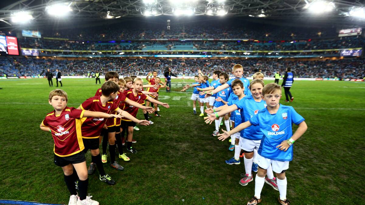 Clermont Bears and Dungog Warriors U9s form a Guard of Honour for the Queensland Maroons and New South Wales Blues.