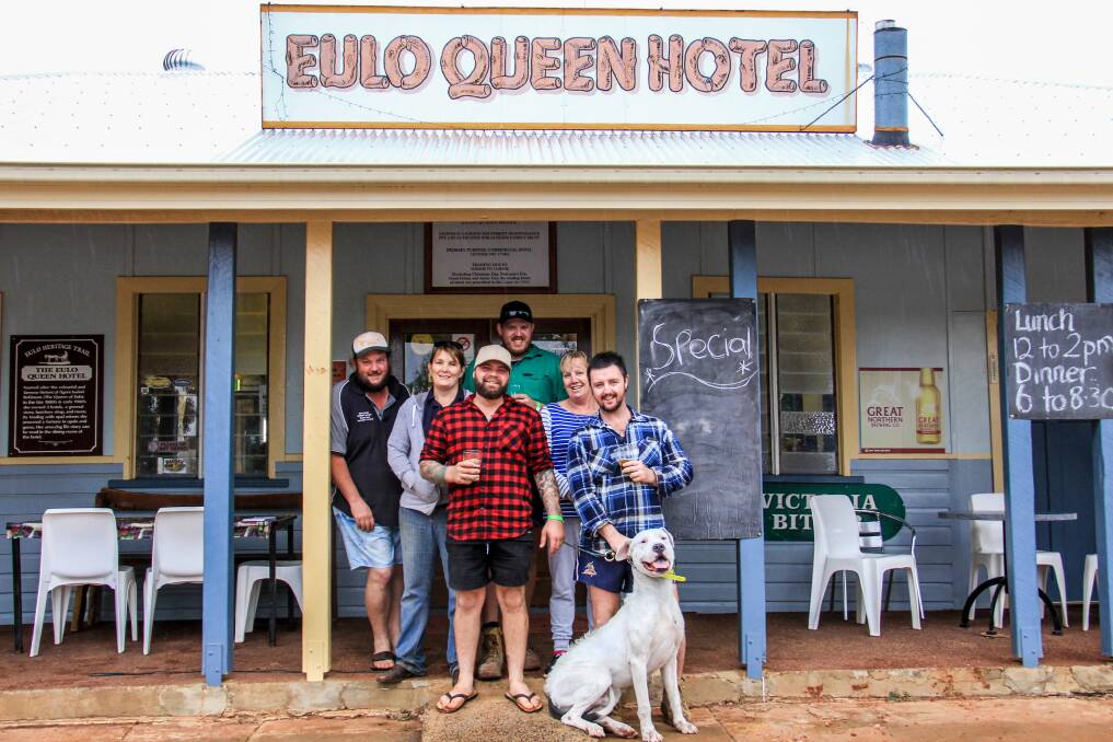Mark Gill, Eulo, hotel manager Janine Gill, Eulo, Gary Hodge, Victoria, Bradley Reardon, Darwin, hotel owner Janelle Jackson, Eulo and Mike Oxchuge, Darwin and dog Snowflake didn't let the rain ruin their party.