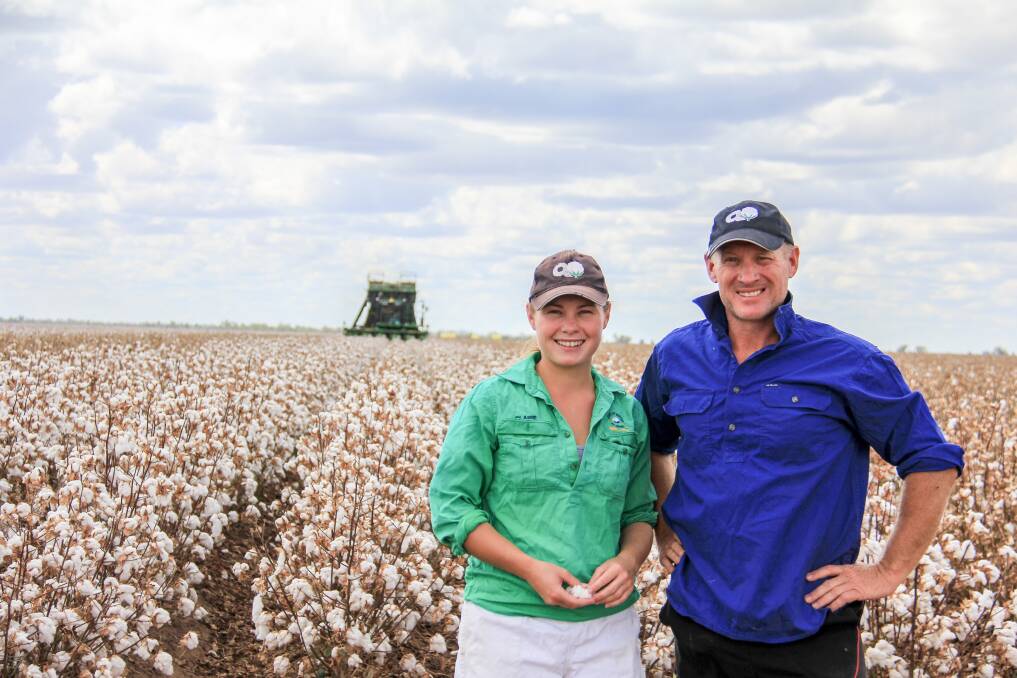 Darren Armstrong (right) and his daughter Claire of Manna Farming Pty Ltd, St George with the first of their cotton crop being harvested. Picture: Lucy Kinbacher