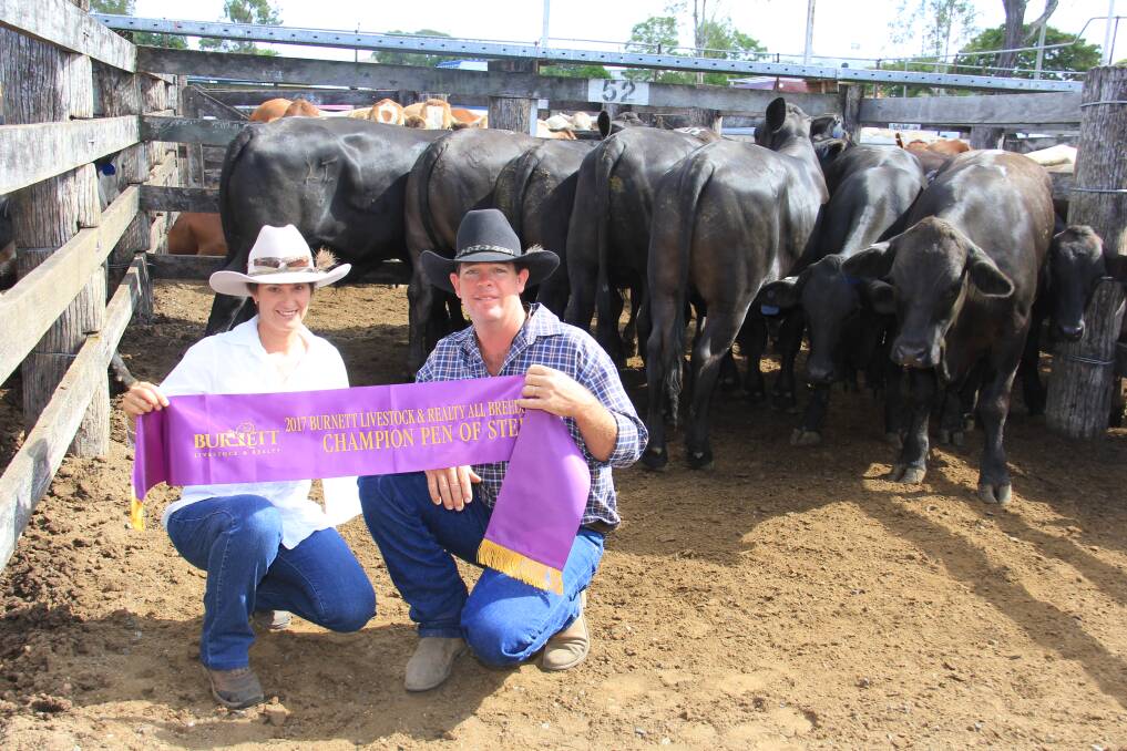 Tracy and Link Davies, Boyne Lea, Mundubbera with their Brangus steers which were named champion pen at the Burnett Livestock & Realty All Breeds Steer Sale. 