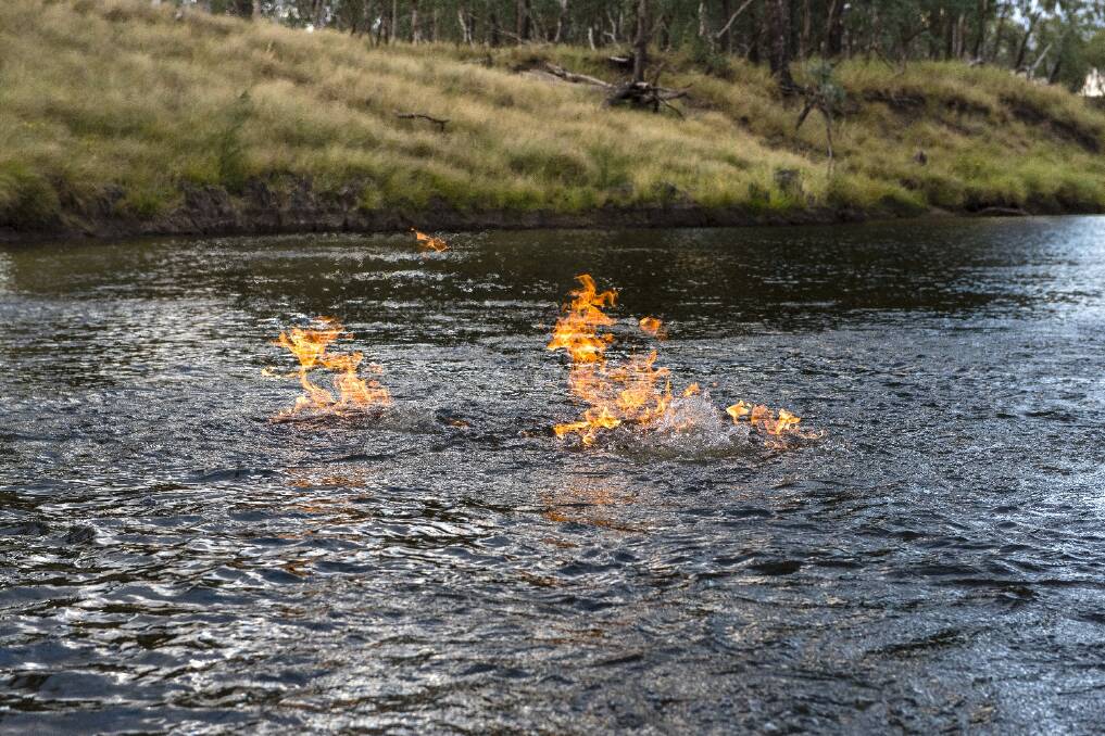 The Condamine River on fire last year. Photo: Max Phillips