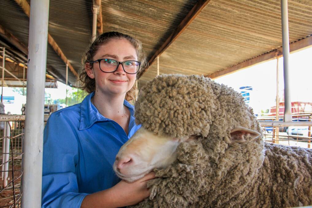 KITCHEN WHIZ: Grace Peskett, Coban, Cunnamulla and her reserve champion fine wool Merino ewe, Lucy. Picture: Lucy Kinbacher